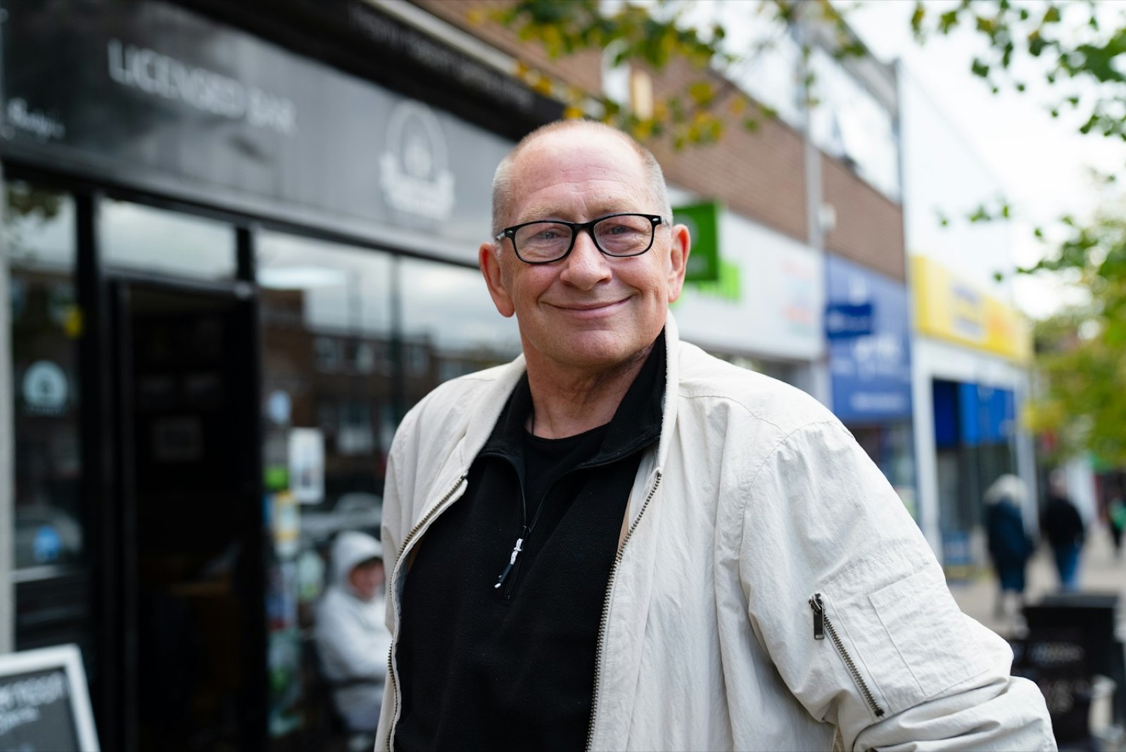 A friendly local shop owner